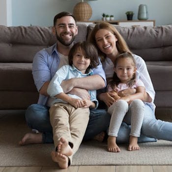 Sarah smiling and enjoying time with her husband and children