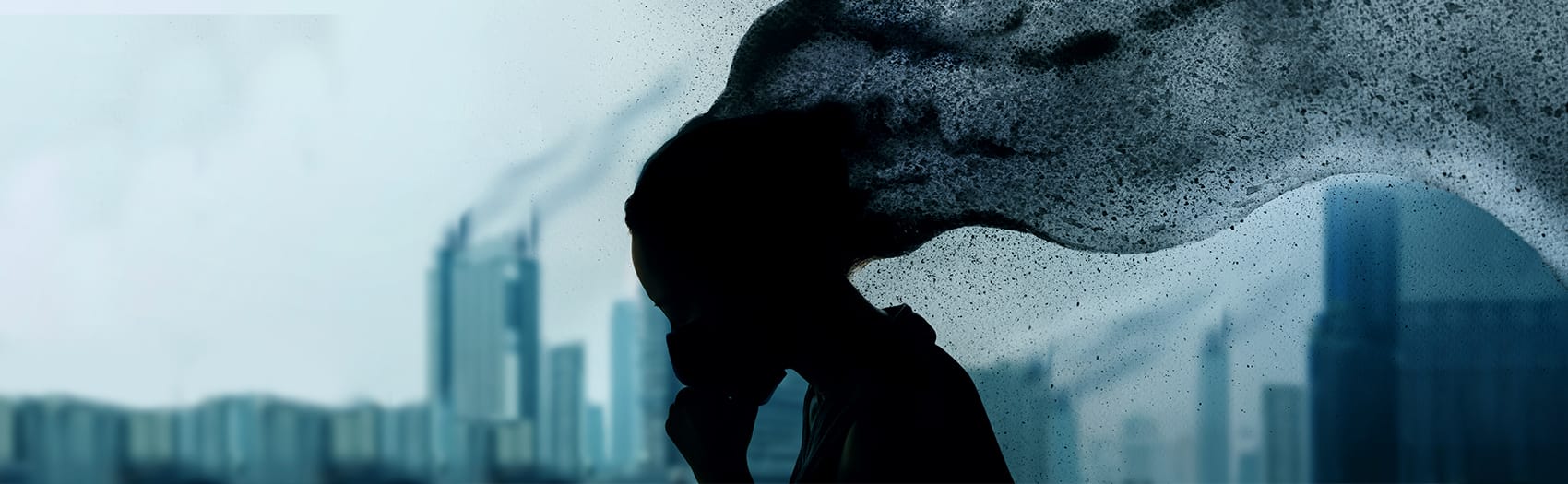 An abstract visual of a woman in darkness with her hair flowing up and out of the shot