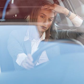A frustrated woman stuck in traffic